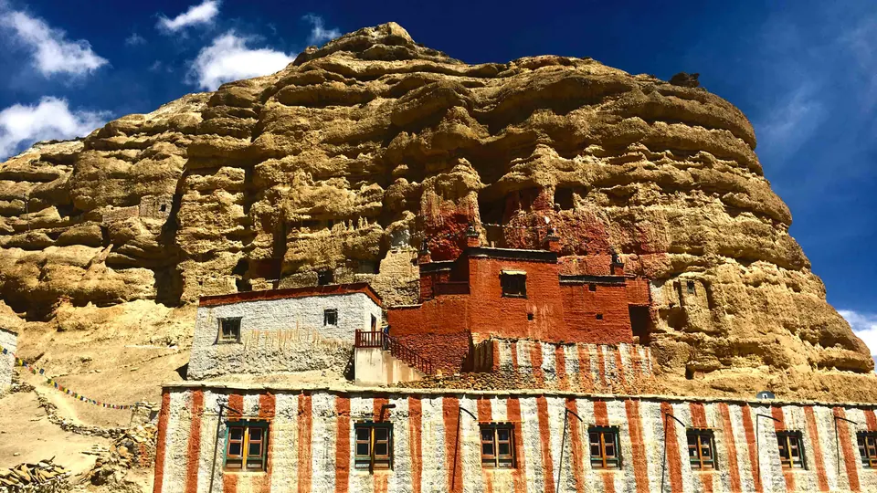 Monastery set against eroded cliffs in Upper Mustang