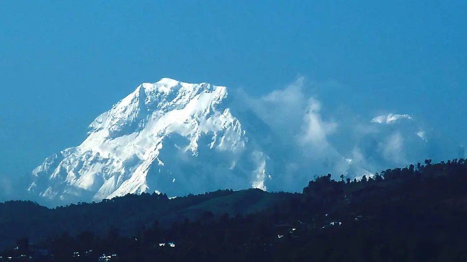 Snow peak above the forested hills near Pokhara