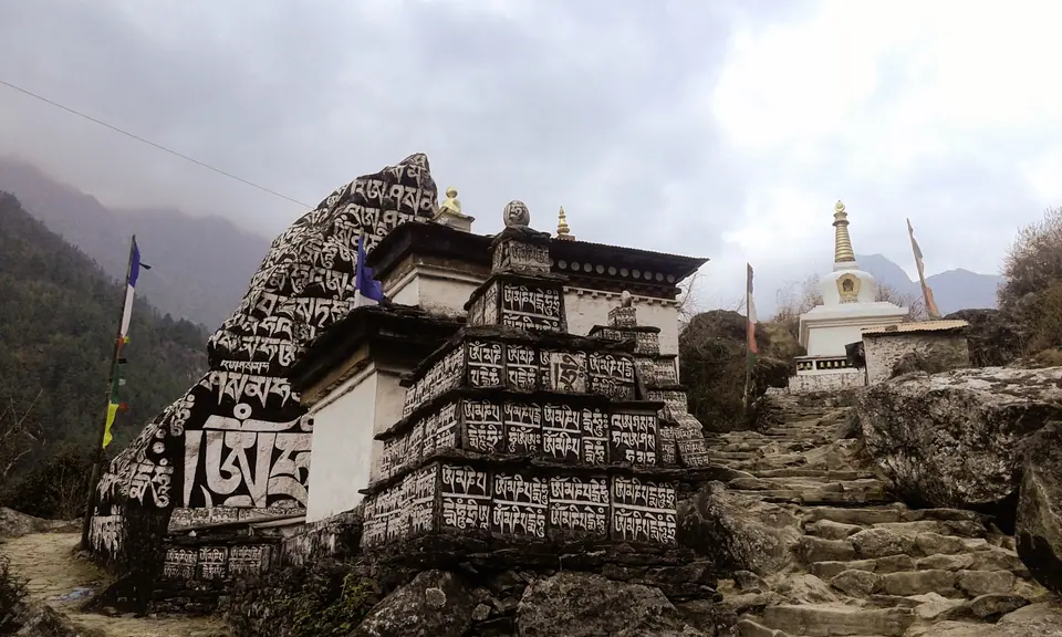 Carved mani stones and a stupa beside the Khumbu trail